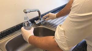 Photo 1 of drinking water sample being taken